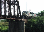 KCS 7021 westbound heads on to the Red River Bridge in downtown Shreveport